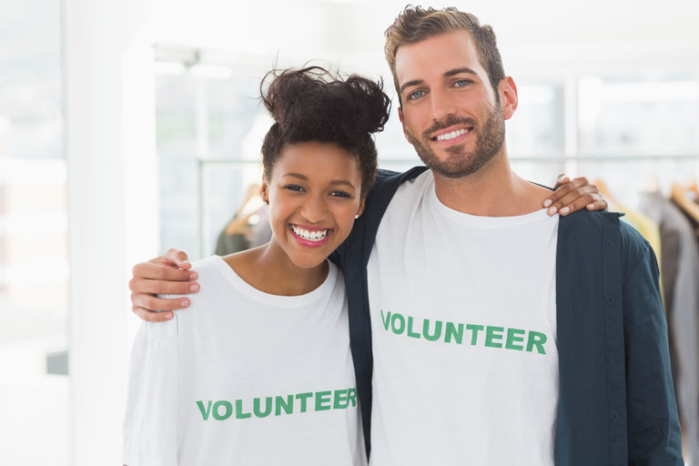 Two volunteers posing for a picture